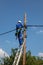 African electrician on a pole