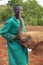 African Elephant keeper with Adopted Baby African Elephant at the David Sheldrick Wildlife Trust in Nairobi, Kenya