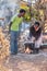 African family cooking in the summer kitchen