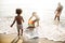 African family enjoy playing the beach