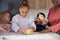 African family kneading cookie dough in the kitchen.