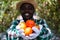 African farmer holding tomato organic produce from farm