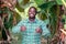 African farmer stand with smile in green banana farm