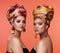 African fashion, beauty and portrait of women on orange background with cosmetics, makeup and accessories. Glamour