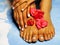 African Female feet and hand, blue pedicure