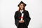 African female graduate smiling holding diploma looking at camera over white background.