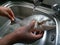 African female hands holding raw sea bream