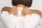African female massaging neck, suffer from pain, spasm or hurting shoulder, back or spine disease
