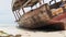 African Fishing Boat Stranded in the Sand on the Beach at Low Tide, Zanzibar