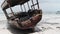 African Fishing Boat Stranded in the Sand on the Beach at Low Tide, Zanzibar