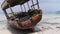 African Fishing Boat Stranded in the Sand on the Beach at Low Tide, Zanzibar