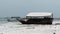 African Fishing Boat Stranded in the Sand on the Beach at Low Tide, Zanzibar