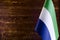 African flags Fragment of the flag of the Republic of Sierra Leone in the foreground space for text blurred background flag of the