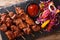 African food: spicy suya kebab on skewers with fresh vegetable s