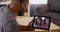 African friends video chatting on tablet