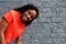 African girl bending down and laughing