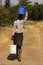 An African girl walking long distance to fetch water in buckets