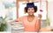 African graduate student with books and diploma