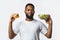 African Guy Holding Burger And Salad Choosing Diet, White Background