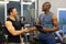 African gym trainer client