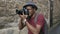 African happy tourist taking photo on his dslr camera. Young man travelling in Europe