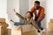 African Husband Riding Wife In Moving Box In New Home