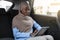 African islamic businesswoman using digital tablet while having trip by car