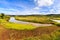 African landscape with river running through rice fields