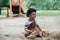 African little boy smile and enjoy playing sand with toys loader on playground outdoors in the park