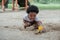 African little boy smile and enjoy playing sand with toys loader on playground outdoors in the park