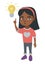 African little girl pointing at the lightbulb.