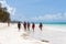 African maasai warriors in traditional clothes on the Zanzibar beach