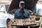 African maintenance male holding a set of car repair tools in box