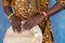 African male hands playing on jembe drum, closeup