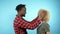 African man and Caucasian woman with Afro hairstyle. blue background