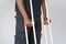 African man with crutch. Close-up. Side view