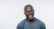 African man, fitness and laugh in studio with excited face, comic joke and training by white background. Personal