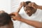 African Man Having Dandruff Problem Looking In Mirror In Bathroom