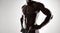 African man with muscular body on grey background