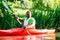 African Man paddling with canoe on forest river