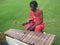 African man playing traditional xylophone