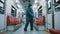 African man with protective suit , face shield, mask and gloves disinfecting interior of the train.