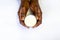 African man`s Hand holding glass of warm fresh milk on white background. Top view food and drink for healthy concept. good calcium