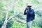 African man traveller take photo in green nature.Freedom concept