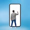 African Man Using Huge Smartphone Over Blue Background, Rear View