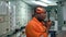 African marine engineer officer in engine control room ECR.