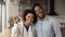 African married young couple holding keys pose on camera