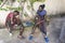 African masai men playing board checkers on a street near the tropical beach on the island of Zanzibar, Tanzania, east Africa