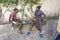 African masai men playing board checkers on a street near the tropical beach on the island of Zanzibar, Tanzania, east Africa