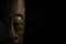 African mask over black background